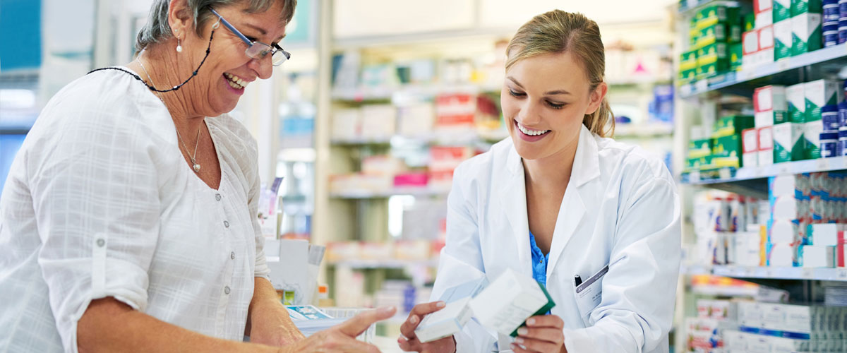 Woman speaking with her pharmacist about her medication