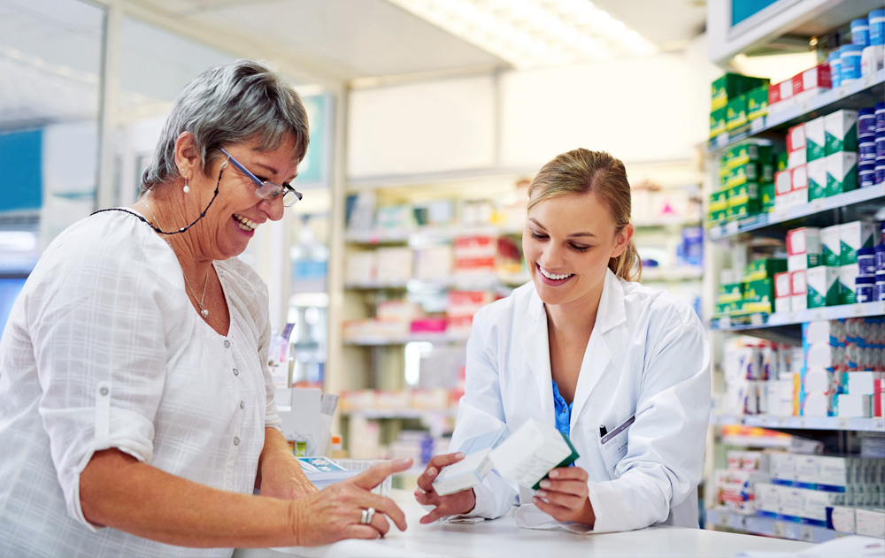 Woman speaking with her pharmacist about her medication